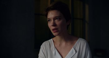 Movie still from “Crimes of the Future” (2022), directed by David Cronenberg – A person wearing a white shirt; Close Up shot, Low angle