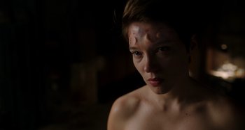 Movie still from “Crimes of the Future” (2022), directed by David Cronenberg – A young woman with makeup on her face; Close Up shot, Low angle