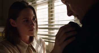 Movie still from “Crimes of the Future” (2022), directed by David Cronenberg – A man and a woman looking at one another; Close Up shot, Over the shoulder angle