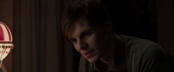 Movie still from “The Conjuring: The Devil Made Me Do It” (2021), directed by Michael Chaves – A young man is looking into the camera; Close Up shot, Over the shoulder angle