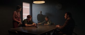 Movie still from “The Conjuring: The Devil Made Me Do It” (2021), directed by Michael Chaves – A group of people sitting around a table; Wide shot, Over the shoulder angle