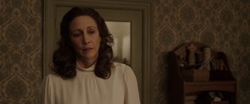 Movie still from “The Conjuring: The Devil Made Me Do It” (2021), directed by Michael Chaves – A woman standing in a room with her eyes closed; Close Up shot, Over the shoulder angle