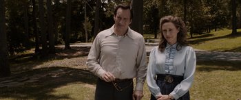 Movie still from “The Conjuring: The Devil Made Me Do It” (2021), directed by Michael Chaves – A man and a woman standing next to each other in a park; Medium shot, Low angle