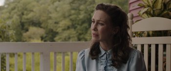 Movie still from “The Conjuring: The Devil Made Me Do It” (2021), directed by Michael Chaves – A woman sitting on a porch looking off into the distance; Close Up shot, Over the shoulder angle