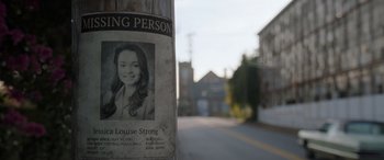 Movie still from “The Conjuring: The Devil Made Me Do It” (2021), directed by Michael Chaves – A missing person sign on a pole; Extreme Close Up shot, Low angle