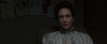 Movie still from “The Conjuring: The Devil Made Me Do It” (2021), directed by Michael Chaves – A woman sitting in a chair in a dark room; Close Up shot, Over the shoulder angle