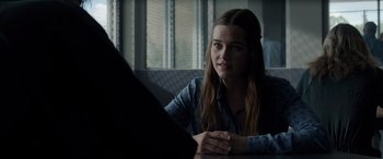 Movie still from “The Conjuring: The Devil Made Me Do It” (2021), directed by Michael Chaves – A woman sitting in front of a laptop computer; Medium shot, Over the shoulder angle