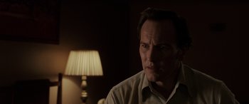 Movie still from “The Conjuring: The Devil Made Me Do It” (2021), directed by Michael Chaves – A person wearing a white shirt; Close Up shot, Low angle