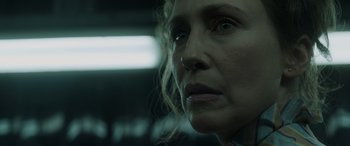 Movie still from “The Conjuring: The Devil Made Me Do It” (2021), directed by Michael Chaves – A woman's face in a dark room; Close Up shot, Low angle