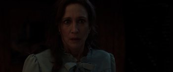 Movie still from “The Conjuring: The Devil Made Me Do It” (2021), directed by Michael Chaves – A person wearing a dress; Close Up shot, Over the shoulder angle