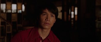 Movie still from “The Conjuring: The Devil Made Me Do It” (2021), directed by Michael Chaves – A person wearing a red shirt; Close Up shot, Over the shoulder angle