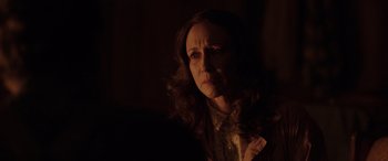 Movie still from “The Conjuring: The Devil Made Me Do It” (2021), directed by Michael Chaves – A person with long brown hair; Close Up shot, Over the shoulder angle