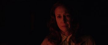 Movie still from “The Conjuring: The Devil Made Me Do It” (2021), directed by Michael Chaves – A person in a dark room; Close Up shot, Over the shoulder angle