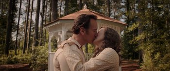 Movie still from “The Conjuring: The Devil Made Me Do It” (2021), directed by Michael Chaves – A man and a woman kissing in front of a gazebo; Close Up shot, Over the shoulder angle