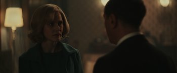 Movie still from “The Courier” (2020), directed by Dominic Cooke – A woman and a man are standing next to each other; Close Up shot, Over the shoulder angle