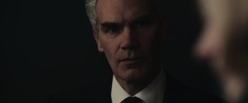 Movie still from “The Courier” (2020), directed by Dominic Cooke – A person wearing a suit and tie; Close Up shot, Low angle
