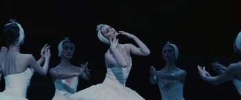 Movie still from “The Courier” (2020), directed by Dominic Cooke – A woman in a white dress and a tiara on her head; Medium shot, Low angle
