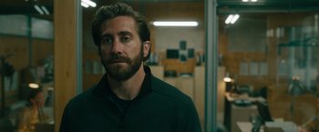 Movie still from “The Covenant” (2023), directed by Guy Ritchie – A person wearing a jacket; Close Up shot, Over the shoulder angle