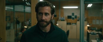 Movie still from “The Covenant” (2023), directed by Guy Ritchie – A person with a beard; Close Up shot, Over the shoulder angle