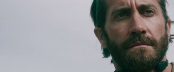 Movie still from “The Covenant” (2023), directed by Guy Ritchie – A person with a beard; Close Up shot, Low angle