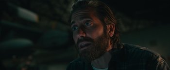 Movie still from “The Covenant” (2023), directed by Guy Ritchie – A person with a beard; Close Up shot, Low angle