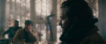 Movie still from “The Covenant” (2023), directed by Guy Ritchie – A person with a beard; Close Up shot, Over the shoulder angle