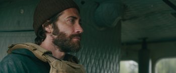 Movie still from “The Covenant” (2023), directed by Guy Ritchie – A person with a beard; Close Up shot, Over the shoulder angle