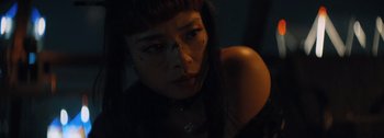 Movie still from “The Creator” (2023), directed by Gareth Edwards – A woman in a dark room looking at the camera; Close Up shot, Low angle