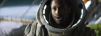 Movie still from “The Creator” (2023), directed by Gareth Edwards – A man in a spacesuit looking into a mirror; Close Up shot, Low angle