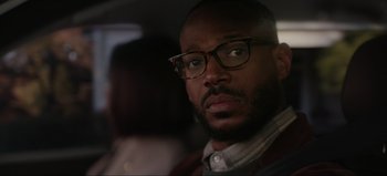 Movie still from “The Curse of Bridge Hollow” (2022), directed by Jeff Wadlow – A person wearing glasses; Close Up shot, Over the shoulder angle