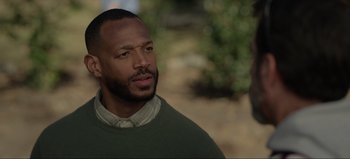 Movie still from “The Curse of Bridge Hollow” (2022), directed by Jeff Wadlow – A person wearing a sweater; Close Up shot, Over the shoulder angle