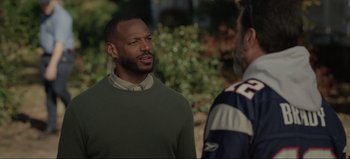 Movie still from “The Curse of Bridge Hollow” (2022), directed by Jeff Wadlow – Two men are standing outside talking to each other; Medium shot, Over the shoulder angle