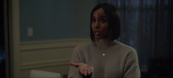 Movie still from “The Curse of Bridge Hollow” (2022), directed by Jeff Wadlow – A woman in a gray sweater talking to someone; Close Up shot, Over the shoulder angle