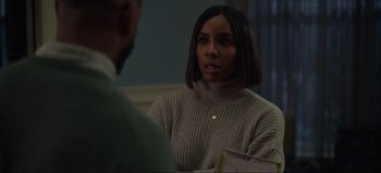 Movie still from “The Curse of Bridge Hollow” (2022), directed by Jeff Wadlow – A woman wearing a sweater talking to a man in a sweater; Close Up shot, Over the shoulder angle