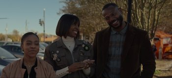 Movie still from “The Curse of Bridge Hollow” (2022), directed by Jeff Wadlow – A man and a woman smiling for the camera; Medium shot, Over the shoulder angle