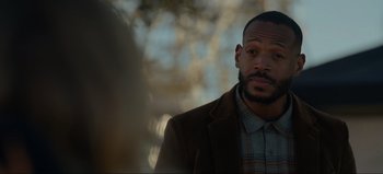 Movie still from “The Curse of Bridge Hollow” (2022), directed by Jeff Wadlow – A person wearing a jacket; Close Up shot, Over the shoulder angle