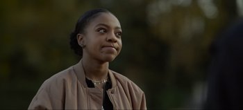 Movie still from “The Curse of Bridge Hollow” (2022), directed by Jeff Wadlow – A young woman looking up at the sky; Close Up shot, Over the shoulder angle
