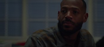 Movie still from “The Curse of Bridge Hollow” (2022), directed by Jeff Wadlow – A person wearing a plaid shirt; Close Up shot, Over the shoulder angle