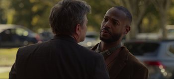 Movie still from “The Curse of Bridge Hollow” (2022), directed by Jeff Wadlow – Two men talking to each other outside in the sun; Close Up shot, Over the shoulder angle