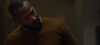 Movie still from “The Curse of Bridge Hollow” (2022), directed by Jeff Wadlow – A person wearing a brown sweater; Close Up shot, Over the shoulder angle