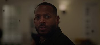 Movie still from “The Curse of Bridge Hollow” (2022), directed by Jeff Wadlow – A person wearing a jacket; Close Up shot, Low angle