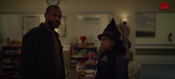 Movie still from “The Curse of Bridge Hollow” (2022), directed by Jeff Wadlow – A man and a woman dressed up as witches; Medium shot, Over the shoulder angle
