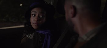 Movie still from “The Curse of Bridge Hollow” (2022), directed by Jeff Wadlow – A young woman sitting in a car looking at a man; Close Up shot, Over the shoulder angle