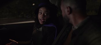 Movie still from “The Curse of Bridge Hollow” (2022), directed by Jeff Wadlow – A man and a woman sitting in the back of a car; Close Up shot, Over the shoulder angle