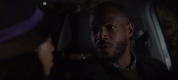 Movie still from “The Curse of Bridge Hollow” (2022), directed by Jeff Wadlow – A person sitting in a car; Close Up shot, Over the shoulder angle