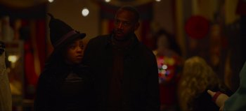 Movie still from “The Curse of Bridge Hollow” (2022), directed by Jeff Wadlow – A man and a woman standing next to each other in the dark; Medium shot, Over the shoulder angle