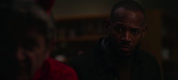 Movie still from “The Curse of Bridge Hollow” (2022), directed by Jeff Wadlow – A man looking at a woman in a black jacket; Close Up shot, Over the shoulder angle