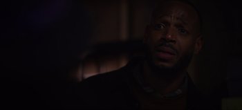 Movie still from “The Curse of Bridge Hollow” (2022), directed by Jeff Wadlow – A person sitting in a chair; Close Up shot, Over the shoulder angle