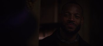 Movie still from “The Curse of Bridge Hollow” (2022), directed by Jeff Wadlow – A person in a dark room; Close Up shot, Over the shoulder angle