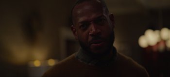 Movie still from “The Curse of Bridge Hollow” (2022), directed by Jeff Wadlow – A person wearing a sweater; Close Up shot, Low angle